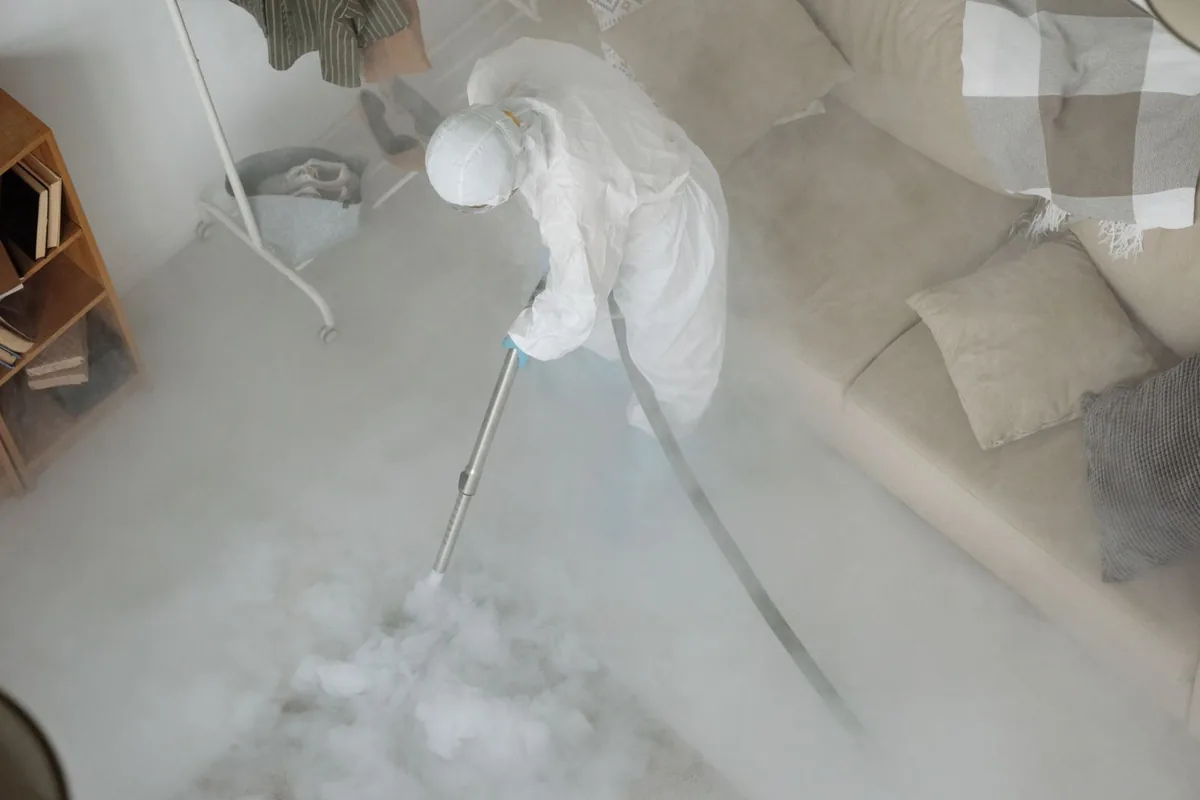 Biohazard cleanup technician in protective equipment, Morningside, Detroit, MI